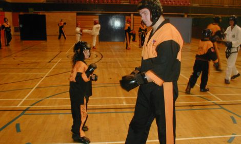 Adults & junior students training in Taekwondo together at one of our Family Classes