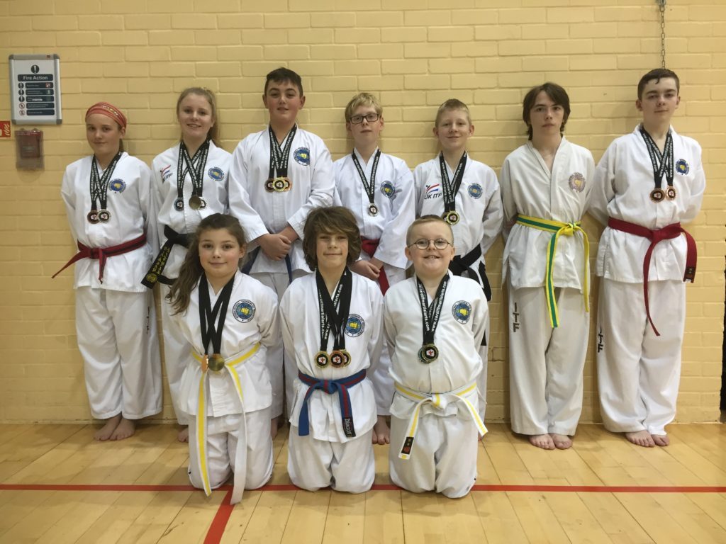 10 Torbay Taekwondo Students wearing their medals from The Cardiff Open Championships Feb 2017