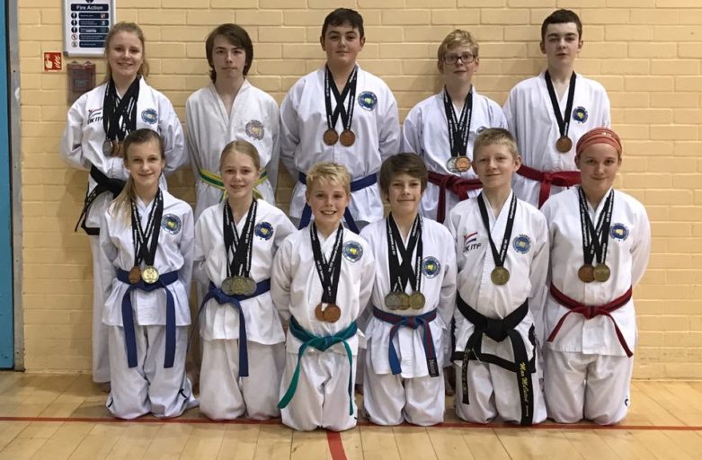 11 Torbay Taekwondo students with their medals from the UkITF Spring National Championships Feb 2017