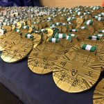 Picture on the medals displayed out over a table at the SW Open Taekwondo Championships May 2018 Hosted By Torbay Taekwondo Schools