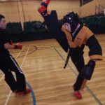 Torbay Taekwondo Students Sparring. Dean Vannan performing Axe Kick