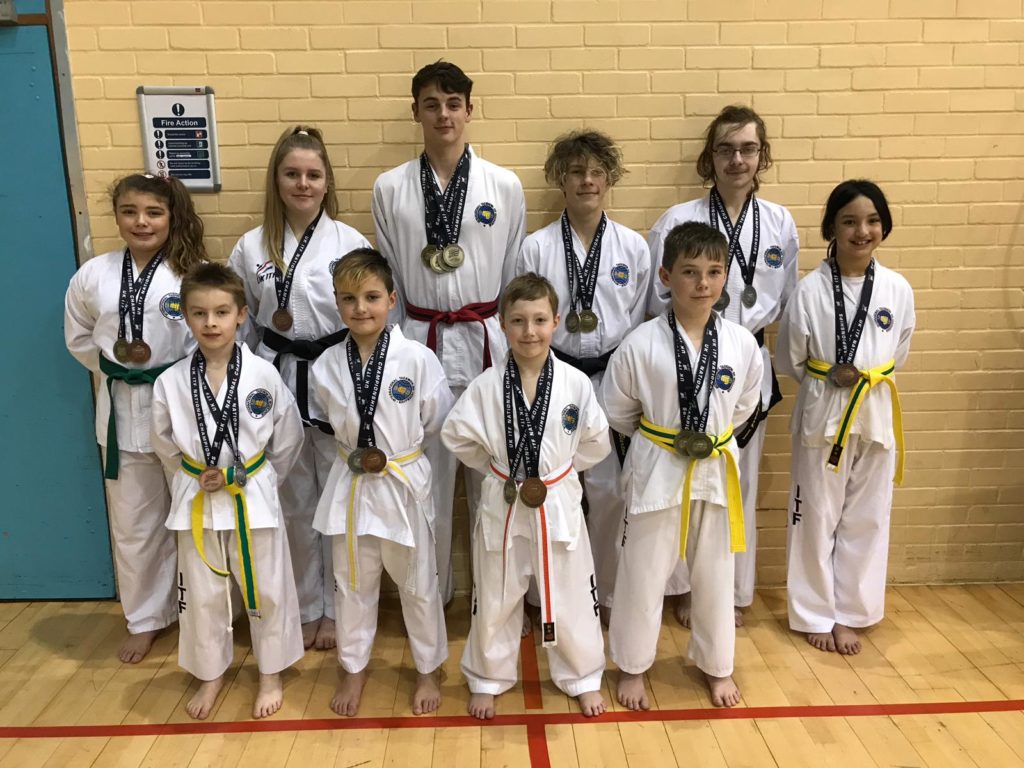 Several members of Torbay Tkd with their medals from the UKITF Spring Championships Feb 2019 in Bath