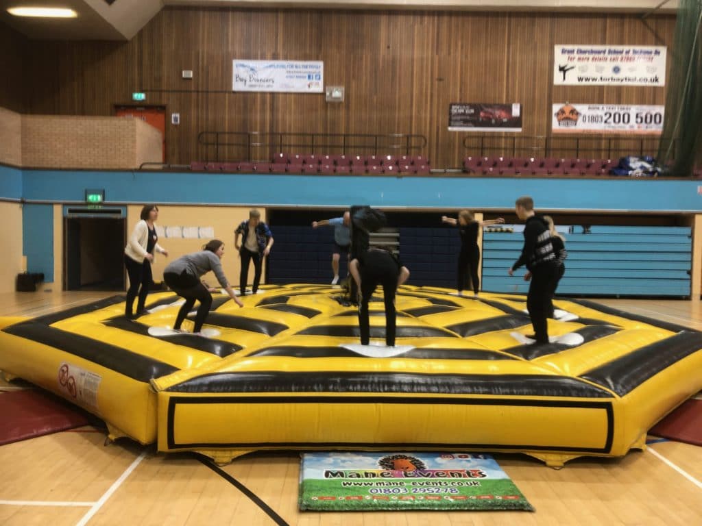 Torbay Taekwondo students enjoying Christmas Party Inflatable fun 2019